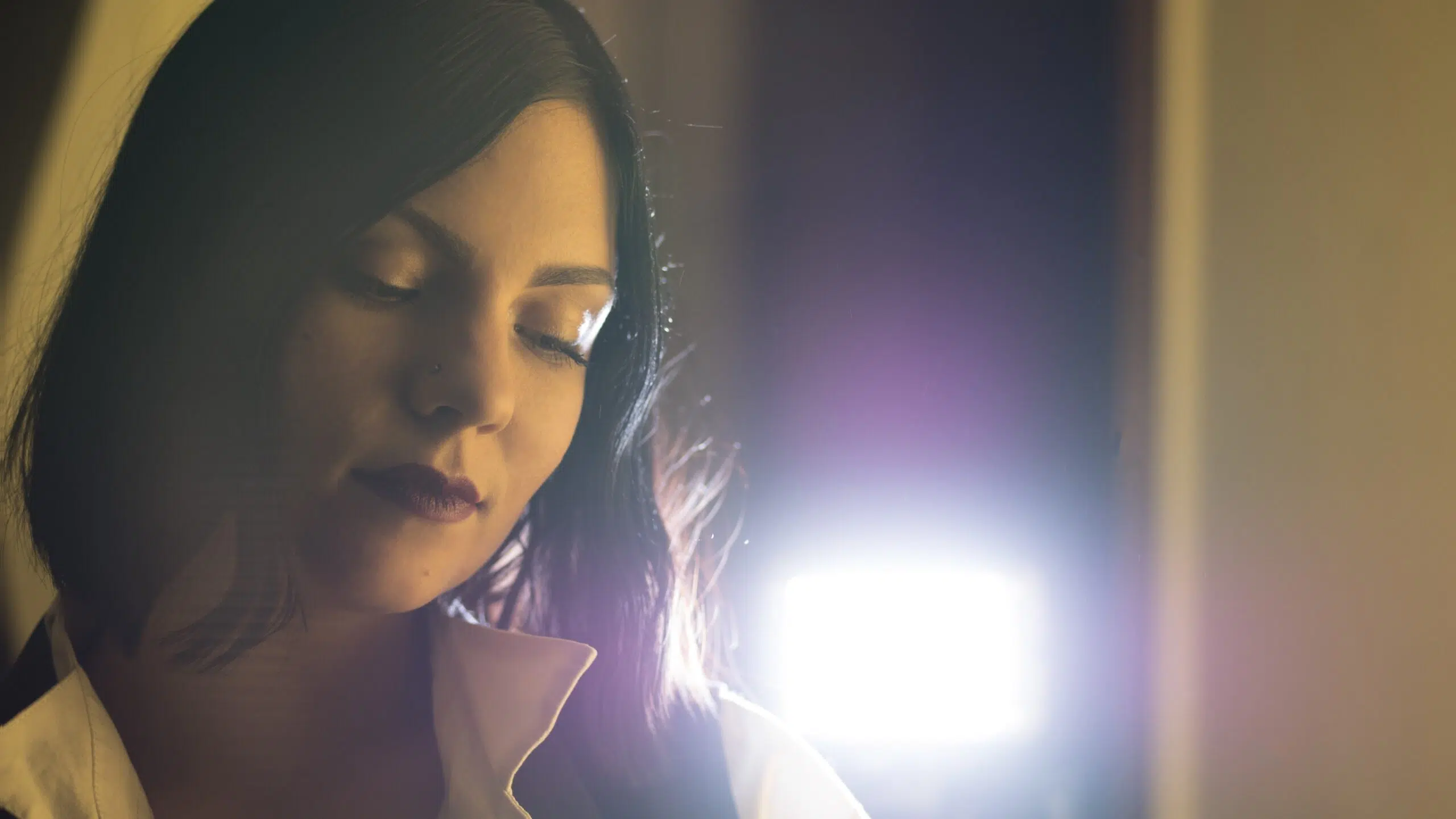 Photographic portrait of actor mom with a spotlight on background