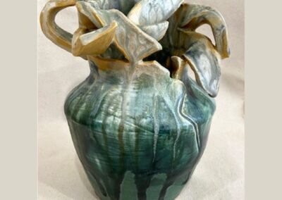Ceramic vase in earth tones. "Motherhood" by Gena Muvali.