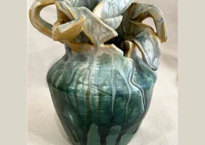 Ceramic vase in earth tones. "Motherhood" by Gena Muvali.