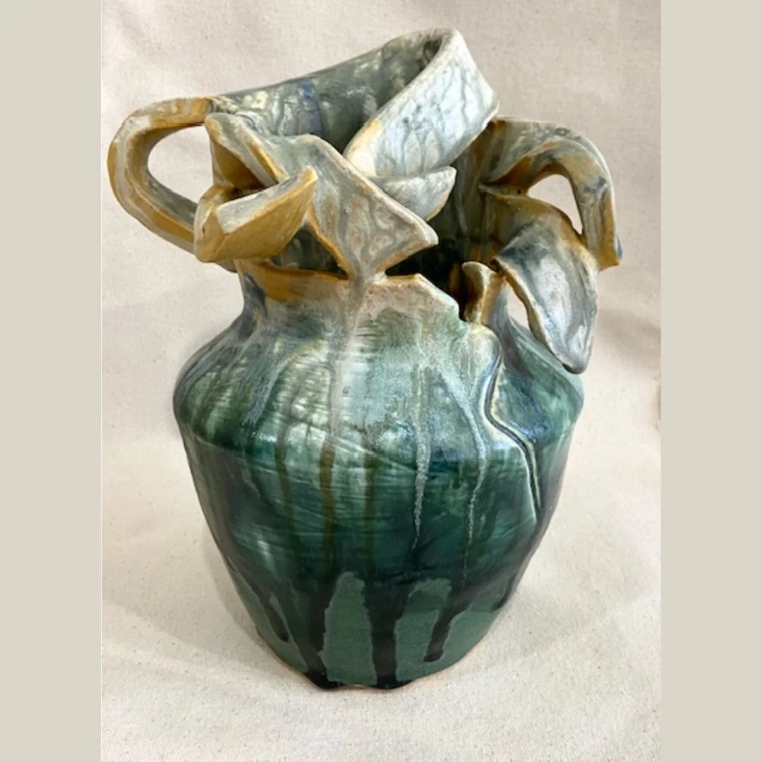 Ceramic vase in earth tones. "Motherhood" by Gena Muvali.