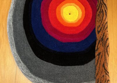 Colorful hand-tufted rug with circles.